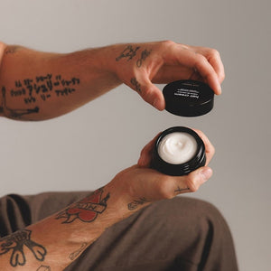 A round, black lid labeled "JACK HENRY - HAIR CREAM" highlights its light hold, moisturizing, defining, and anti-frizz benefits. The JACK HENRY brand name and size (1.6oz/50ml) are displayed—ideal for light hold and nourished hair.