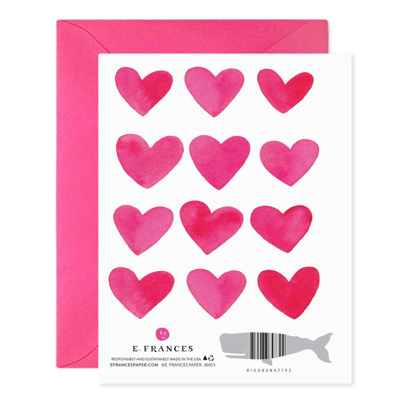 The E. FRANCES PAPER "If I Had More Hearts" Valentine Greeting Card features twelve pink watercolor hearts in a 3x4 grid on luxurious paper, with a message: "If I had more hearts, they would all be yours," and comes with a matching pink envelope.
