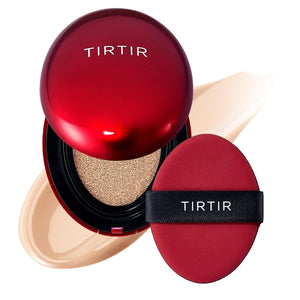 A red compact case labeled “TIRTIR” with a matching applicator puff rests on a smear of beige cushion foundation, highlighting the TIRTIR - MASK FIT RED CUSHION FOUNDATION IN IVORY, MINI by KOSMIC KBEAUTY SKINCARE—an innovative and hydrating foundation that delivers flawless coverage.