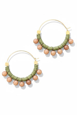 The DAVID AUBREY - GREEN AND PEACH HOOP EARRINGS by DAVID AUBREY feature gold plated hoops adorned with green polymer discs and round peach beads hanging along the bottom, shown against a flat gray background.