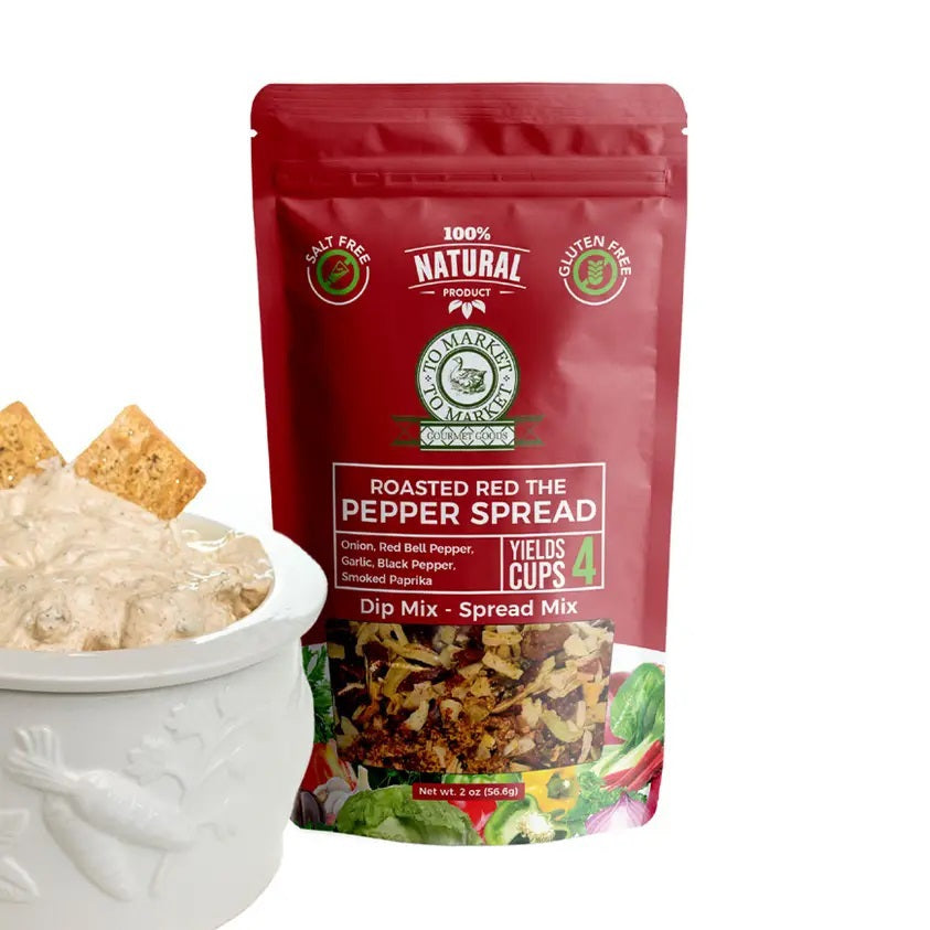 A red packet of TO MARKET - ROASTED RED PEPPER SPREAD DIP MIX from TO MARKET- DIPS & SPREADS stands upright beside a white bowl filled with creamy dip and crackers. The packaging highlights that the mix is all-natural, makes 4 cups, and is both gluten-free and salt free. Infused with smoked paprika, this bold, smoky spread is perfect for adding robust flavor to any gathering.