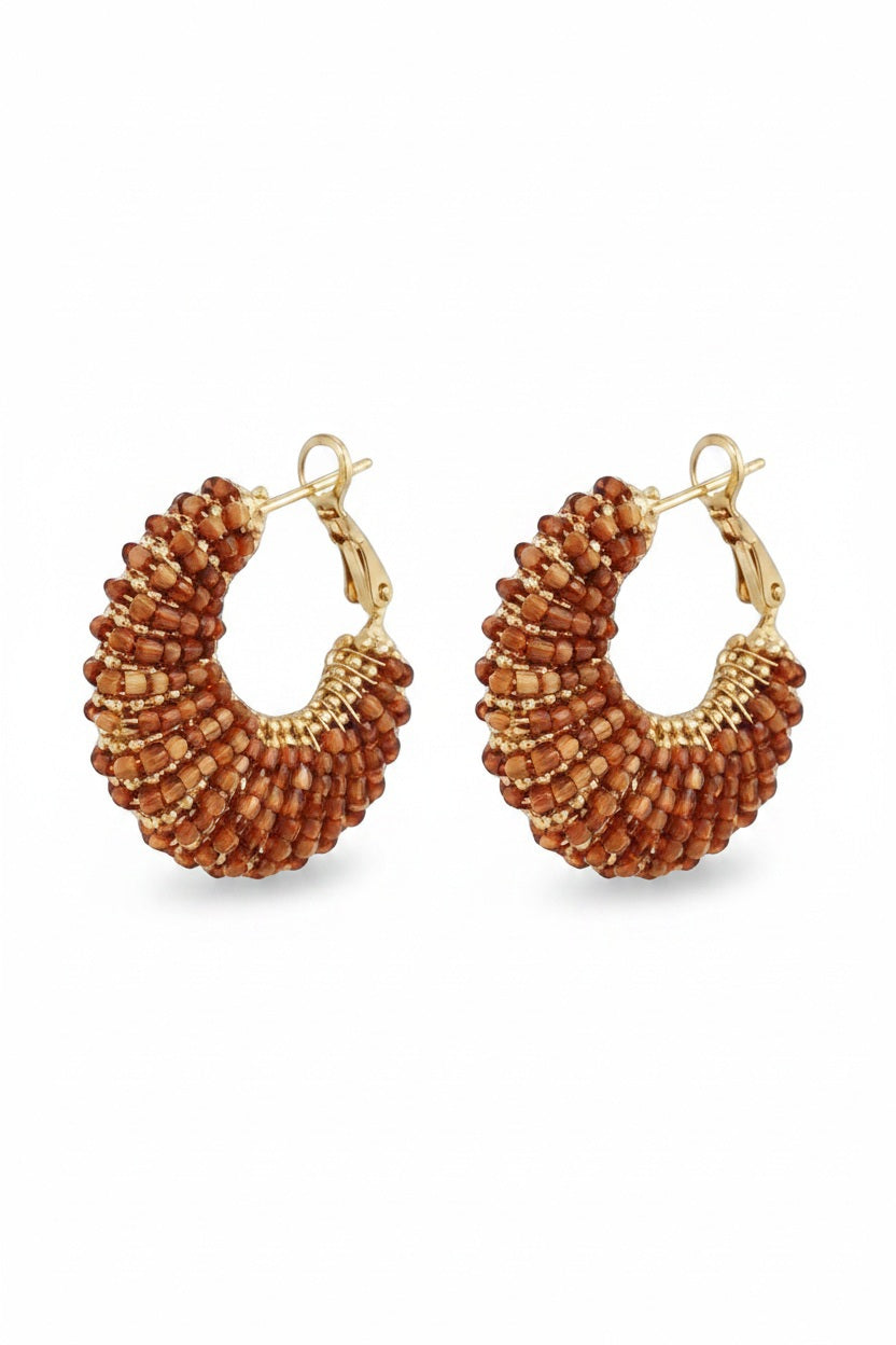 The GAS BIJOUX IZZIA Earrings are gold-plated, handmade earrings with clusters of small, round reddish-brown beads in a textured fan-like design and secure latch-back closures.