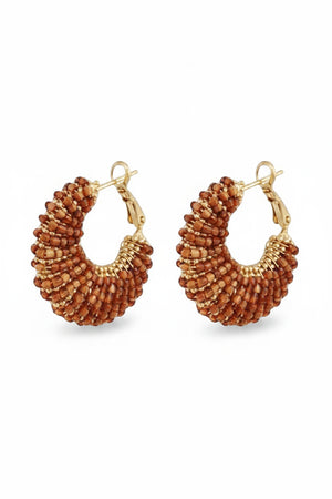 The GAS BIJOUX IZZIA Earrings are gold-plated, handmade earrings with clusters of small, round reddish-brown beads in a textured fan-like design and secure latch-back closures.