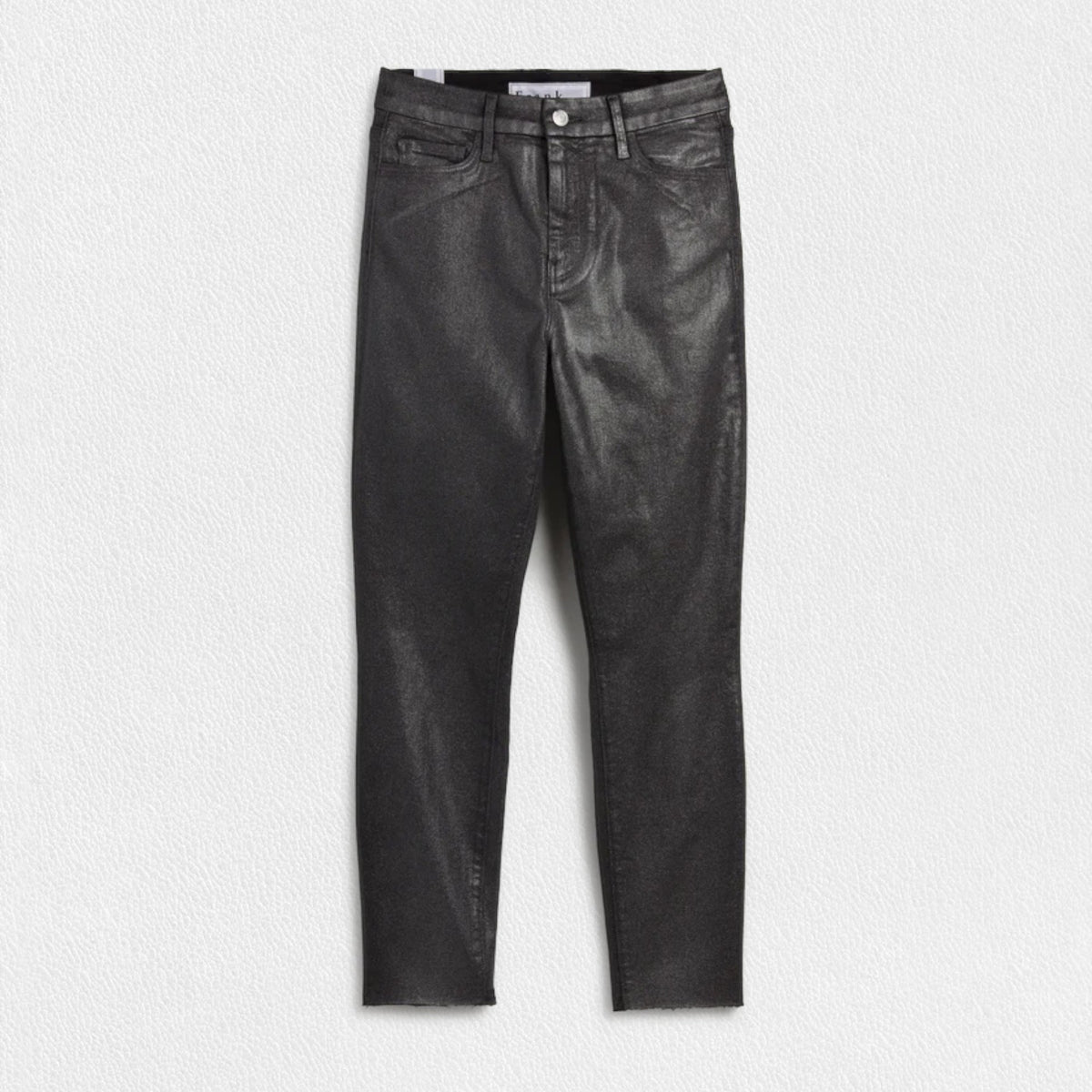 A person wearing a white shirt, FRANK &amp; EILEEN&#39;s SLIGO SKINNY JEAN in Black Metallic with a high-rise waistband, and black shoes is walking through a doorway, with a decorated dining room in the background and Christmas lights visible on a tree outside.