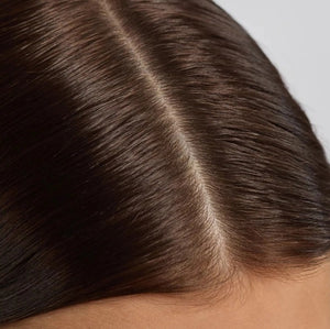 A dropper bottle and box of KITSCH - STRENGTHENING HAIR & SCALP OIL, featuring rosemary and biotin for dry scalp and hair, in a 2 fl. oz. size, are displayed against a simple light background. This plant-based formula by KITSCH is designed to support scalp health and strengthen hair.