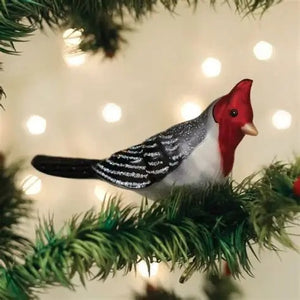 An OLD WORLD CHRISTMAS RED CRESTED CARDINAL CLIP ORNAMENT shaped like a red-crested cardinal with a grey body, white striped wings, and a black tail.