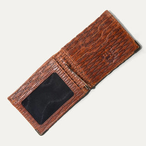 The WILL LEATHER GOODS Industrialist Billfold in Cognac Basketweave, shown open with an ID window and closed to reveal its full-grain leather texture, features RFID-blocking and is set against a plain light background.
