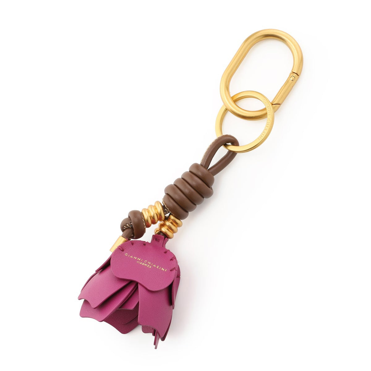 The GIANNI CHIARINI Desert Flower Key Ring/Bag Charm features a gold keychain with a purple synthetic leather flower, brown leather and gold bead accents, plus a gold clip and ring.