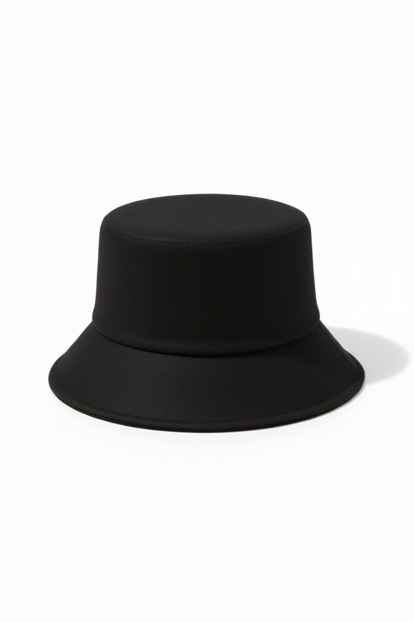WYETH's TENLEY BUCKET HAT, a blue bucket hat made from fuzzy mohair wool and featuring a wide brim, is presented against a simple white background.