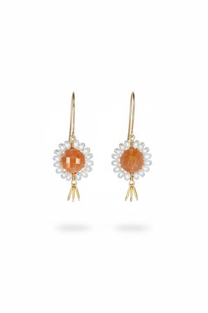 GOLDISH - Floral Gemstone Earrings in Pink Moonstone and White Pearl feature delicate 14K gold fill fringe beneath pink moonstones and white pearls, displayed on a white stand for an elegant look.