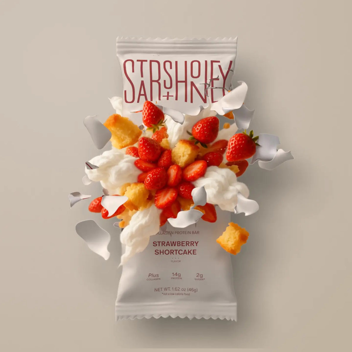 A STARS+HONEY - STRAWBERRY SHORTCAKE Collagen Protein Bar wrapper bursts open, releasing strawberries, cake pieces, and swirls of whipped cream against a neutral background—perfectly capturing the delicious essence of this wholesome treat. Enjoy all the flavor you love in strawberry shortcake, now in a nourishing STARS+HONEY Collagen Protein Bar.