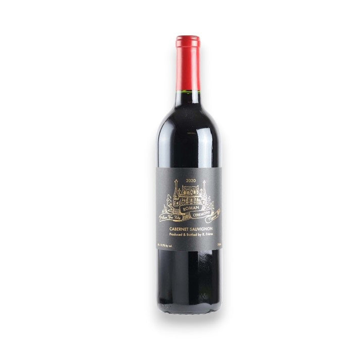 A bottle of RAILSBACK FRERES 'Roman Ceremony' Cabernet Sauvignon 2021 from WINE: TRYON, with a gold chateau illustration on the label and red foil top, is displayed against a white background. Shipping available in North Carolina.