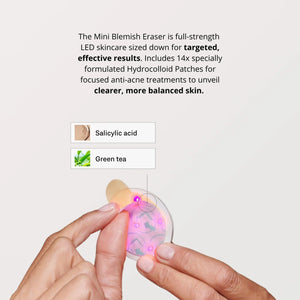 A round, white OMNILUX - BLEMISH ERASER KIT device from OMNILUX features a teal rim, power button, and logo; a soft pink light glows from underneath, showcasing its advanced blue and red light therapy technology.