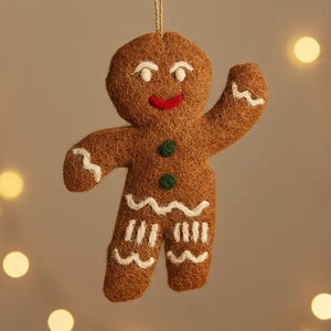 JOLLY GINGERBREAD MAN ORNAMENT by FELT SO GOOD, a handmade felt gingerbread man with a waving arm and a string loop for hanging.