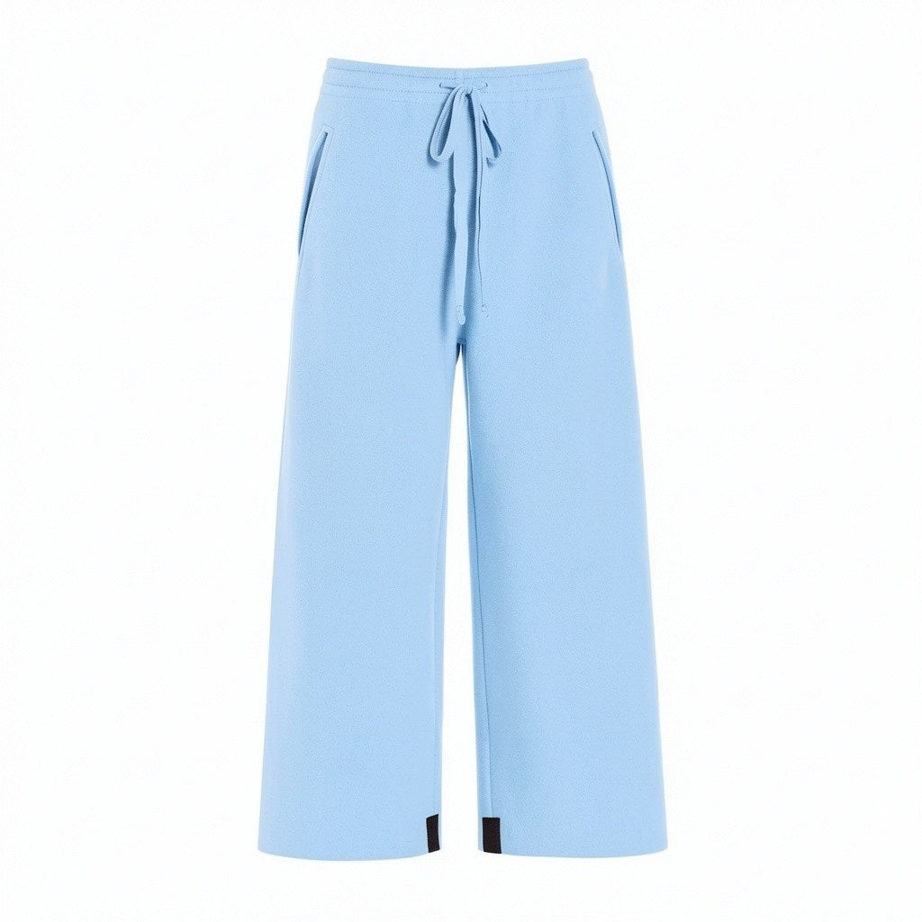 Here’s a rewritten version using your product data: A sizing guide chart for the HENRIETTE STEFFENSEN - FLEECE FLARED CROPPED TROUSER by HENRIETTE STEFFENSEN, featuring measurements for chest, waist, and hips in centimeters for sizes XS to XXL—including information specific to fleece pants and flared trousers—with separate charts for normal and loose fits, plus a diagram illustrating where to measure.