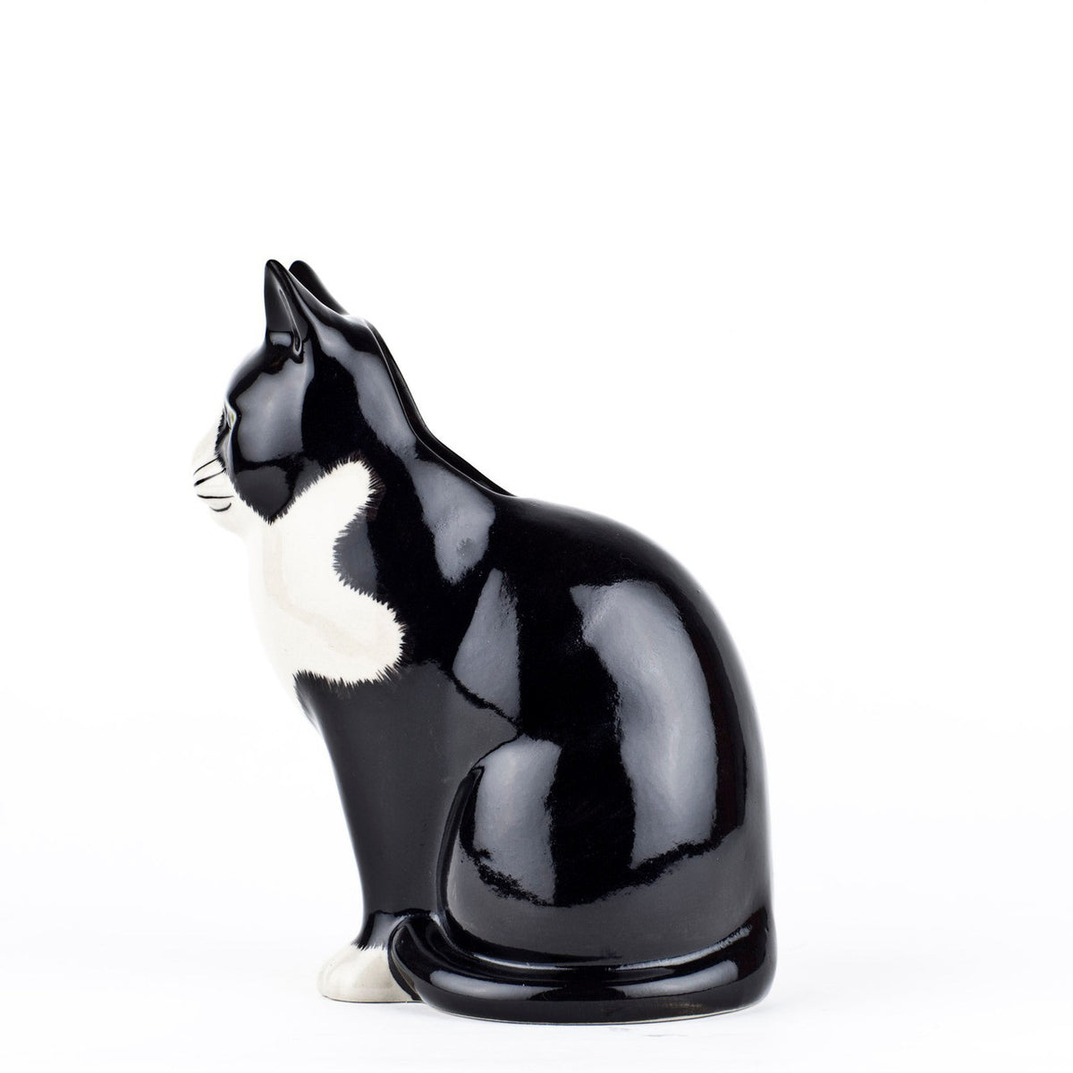 The QUAIL CERAMICS - BARNEY CAT FLOWER VASE SMALL by QUAIL DESIGNS is a hand-painted stoneware ceramic vase shaped like a black and white cat with upright ears, green eyes, and a calm expression.