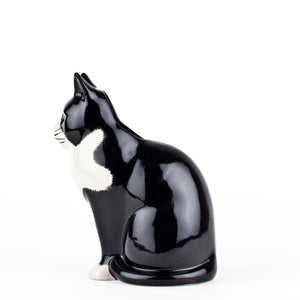The QUAIL CERAMICS - BARNEY CAT FLOWER VASE SMALL by QUAIL DESIGNS is a hand-painted stoneware ceramic vase shaped like a black and white cat with upright ears, green eyes, and a calm expression.