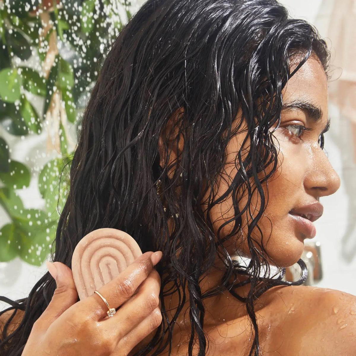 A KITSCH - STRENGTHENING BOND REPAIR SOLID HAIR MASK BAR rests by its brown box with bamboo stems, highlighting its vegan keratin formula for glass hair that's color safe and pH balanced.