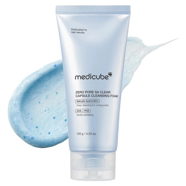 A tube of KOSMIC KBEAUTY SKINCARE MEDICUBE - ZERO PORE CAPSULE CLEANSING FOAM (120g) with blue capsules. This cleansing foam effectively targets pores and excess oil, refines skin texture, is non-comedogenic tested, and suitable for double cleansing.