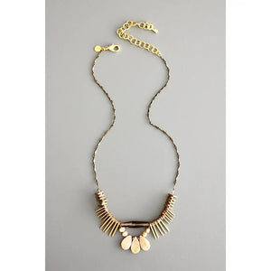 The DAVID AUBREY - ATHENA PEARL SMOKEY QUARTZ NECKLACE features a delicate gold chain, adjustable clasp, and fan-shaped pendant with cream and gold accents—a perfect handcrafted Mother's Day gift from DAVID AUBREY, shown on a gray background.