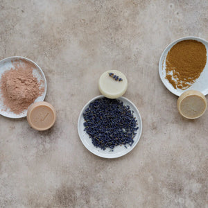 The L’AUGUSTE PROVENCE Set of Handcrafted French Soaps features three round soaps in a white box, with the left soap topped with dried lavender—an elegant Provence-inspired gift set.