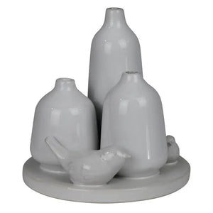 The HOMART CERAMIC VASE TRIO WITH TWO BIRDS features three matte white minimalist vases of varying heights and two bird figurines on a 5.5-inch round base; tallest vase stands 5 inches—ideal for bird vase decor.