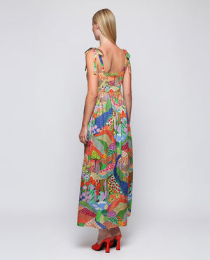 The MIRTO 1956 Multicolor Print Maxi Dress is a sleeveless cotton dress with tie straps, a square neckline, and a vibrant patchwork of floral and geometric designs in red, green, blue, yellow, and purple.