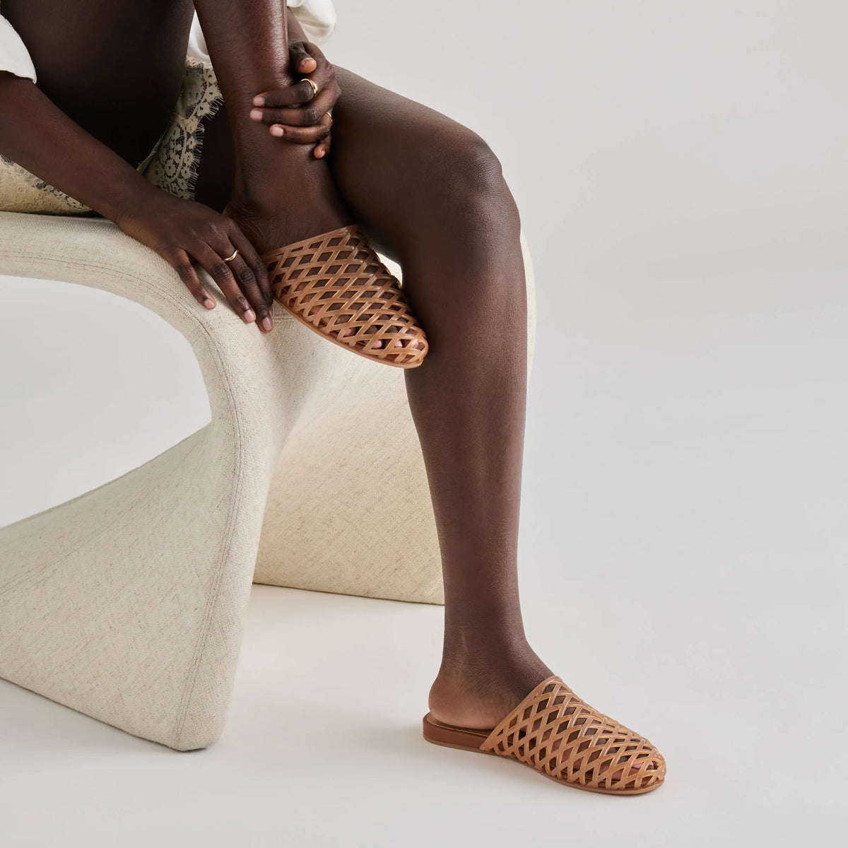 DOLCE VITA - GINNA JELLY FLATS IN WHISKEY featuring a tan jelly flat with a woven, crisscross cage design in a versatile slip-on sandal style.