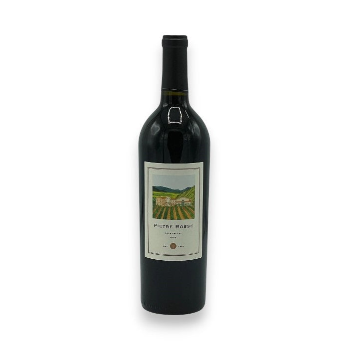 The DALLA VALLE PIETRE ROSSE 2018 from WINE: KELLOGG SELECTIONS features a Napa Valley vineyard label, showcasing green hills under a blue sky. With hints of red fruits, the wine bottle is set against a plain white background.