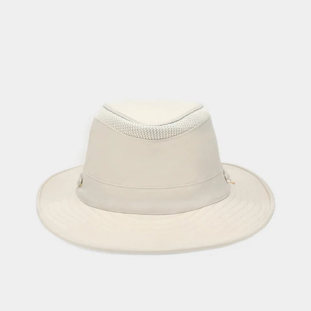 The TILLEY AIRFLO BROAD BRIM HAT LTM6 in Light Stone is a recycled nylon sun hat with UPF 50+ protection, wide brim, mesh ventilation near the crown, and a small band tag. Shown on a plain white background.