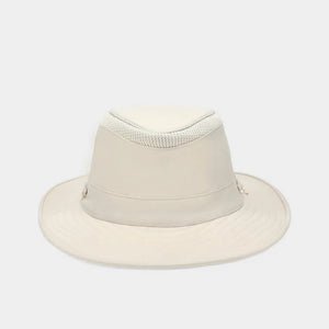 The TILLEY AIRFLO BROAD BRIM HAT LTM6 in Light Stone is a recycled nylon sun hat with UPF 50+ protection, wide brim, mesh ventilation near the crown, and a small band tag. Shown on a plain white background.