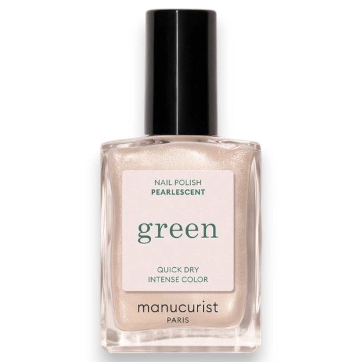 Wearing a black satin top, a person holds a bottle of MANUCURIST - GREEN™ NAIL POLISH IN PEARLESCENT by MANUCURIST INC, displaying their neatly manicured nails.