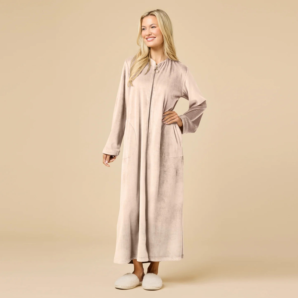 A long-sleeved, beige SOFTIES - SERENITY SHEAR MINK ZIP ROBE featuring a full-length zipper, round neckline, and two side pockets.