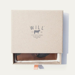 Two WILL LEATHER GOODS Military Pocket Card Cases in military green are shown on a light background: one features RFID-blocking protection with a transparent ID slot, while the other displays card slots and an embossed animal logo.