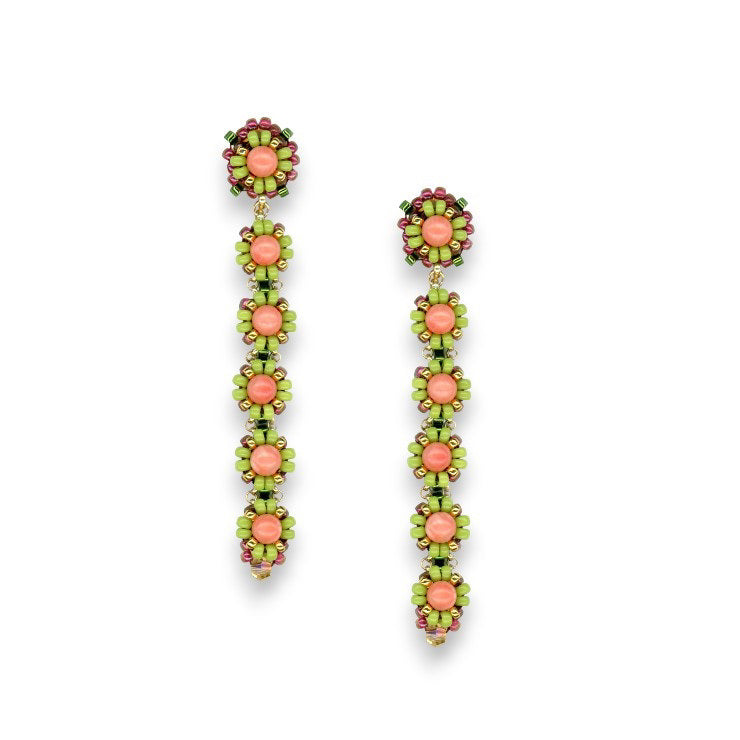 Experience the elegance of the MIGUEL ASES - PINK CORAL MIYUKI DROP EARRINGS by MIGUEL ASES, INC. These handcrafted beaded earrings feature a floral design with pink and green beads, reminiscent of Miguel Ases jewelry. Each piece showcases a circular flower at the top and a vertical row of smaller flowers below, creating a cascading effect. Predominantly pink and green in color, these earrings are accented with 14K gold-fill for added sophistication.