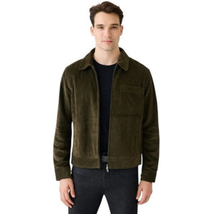 The MACK WELDON - CORDUROY ZIP JACKET is a modern-fit, dark blue corduroy jacket with a front zipper, long sleeves, collar, and chest pocket—shown against a white background.