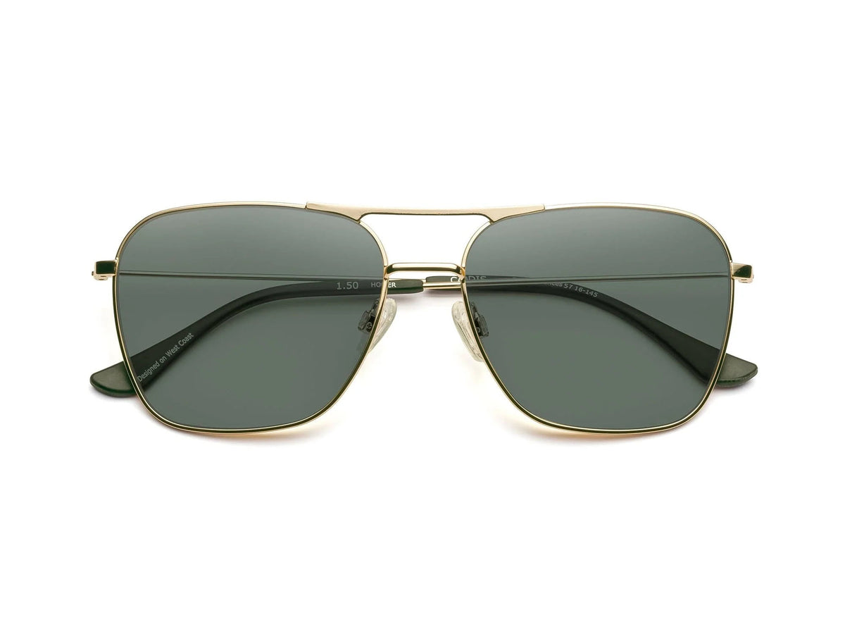The CADDIS HOOPER Sunglasses feature a gold metal aviator-style frame, dark green polarized lenses, double bridge, black temple tips, and lightweight design, shown from the front against a white background.