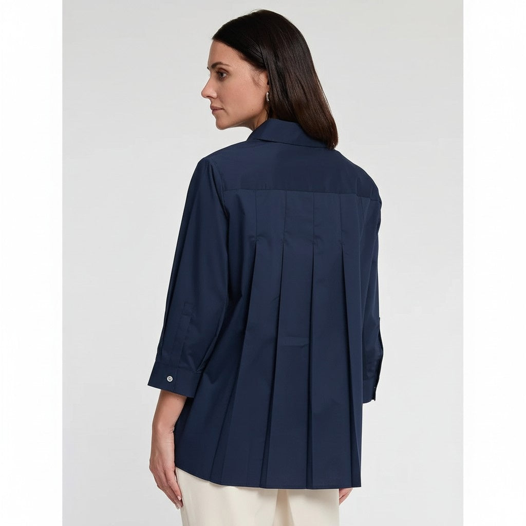 A person with straight brown hair is shown from the back, wearing the HINSON WU SARA Long Sleeve Pleated Back Shirt and black pants, standing against a plain light background.