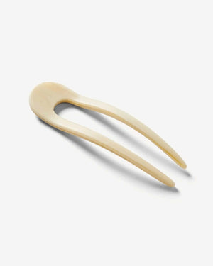 A smooth, black MACHETE - FRENCH HAIR PIN with two prongs, crafted from Italian acetate by MACHETE, rests on a plain white surface.