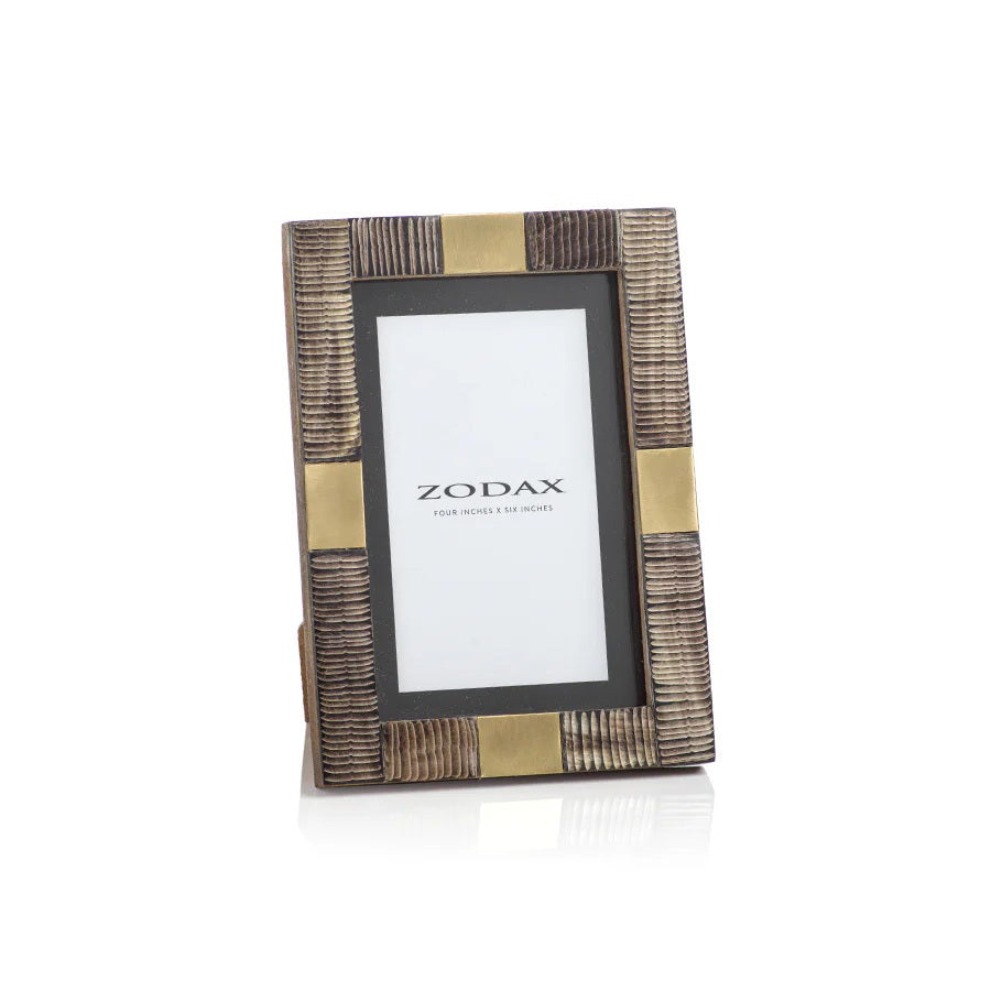 The ZODAX LAGOS HORN AND BRASS PHOTO FRAME 4x6 features a ribbed, brown and gold design, displaying a &quot;ZODAX&quot; placeholder for 4x6-inch photos. This elegant frame stands upright on a white background.