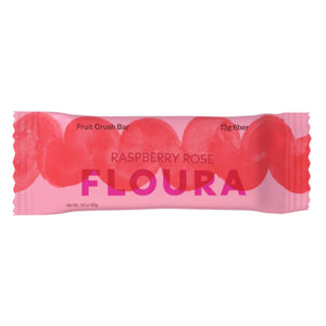A pink wrapper for FLOURA & CO’s RASPBERRY ROSE FLOURA FIBER CRUSH BAR features bold red circles and product text. This 1.8 oz (50g) gut health snack contains 13g fiber and is a delicious, high-fiber bar.