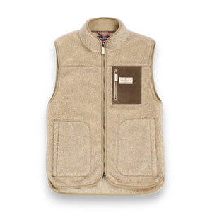 AMUNDSEN SPORTS - HEROES FLEECE VEST NATURAL by AMUNDSEN SPORTS is a beige sherpa wool fleece vest with a high collar, front zipper, two side pockets, and a waxed cotton chest pocket detailed with a small label. Made in Portugal, the vest is displayed laid flat on a white background.