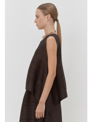 Close-up of MEIMEIJ Plisse Sleeveless Top's dark textured fabric displays a finely woven pattern. The consistent monochrome color and texture, with subtle weave variations, reflect minimalist elegance.