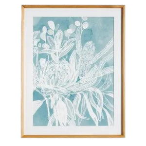 A framed protea abstract print in soft blue by NAPA HOME AND GARDEN, featuring a white floral illustration on a blue background. This botanical wall art is presented in a light wood frame for a fresh, contemporary look—perfect for modern home décor.
