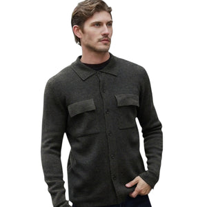 Close-up of gray, ribbed knit fabric with a vertical pattern. The yarn texture and individual stitches are clearly visible, highlighting the soft and cozy feel of the AUTUMN CASHMERE Milano Stitch Shacket in Grizzly—a luxury shirt jacket expertly crafted for both comfort and style.