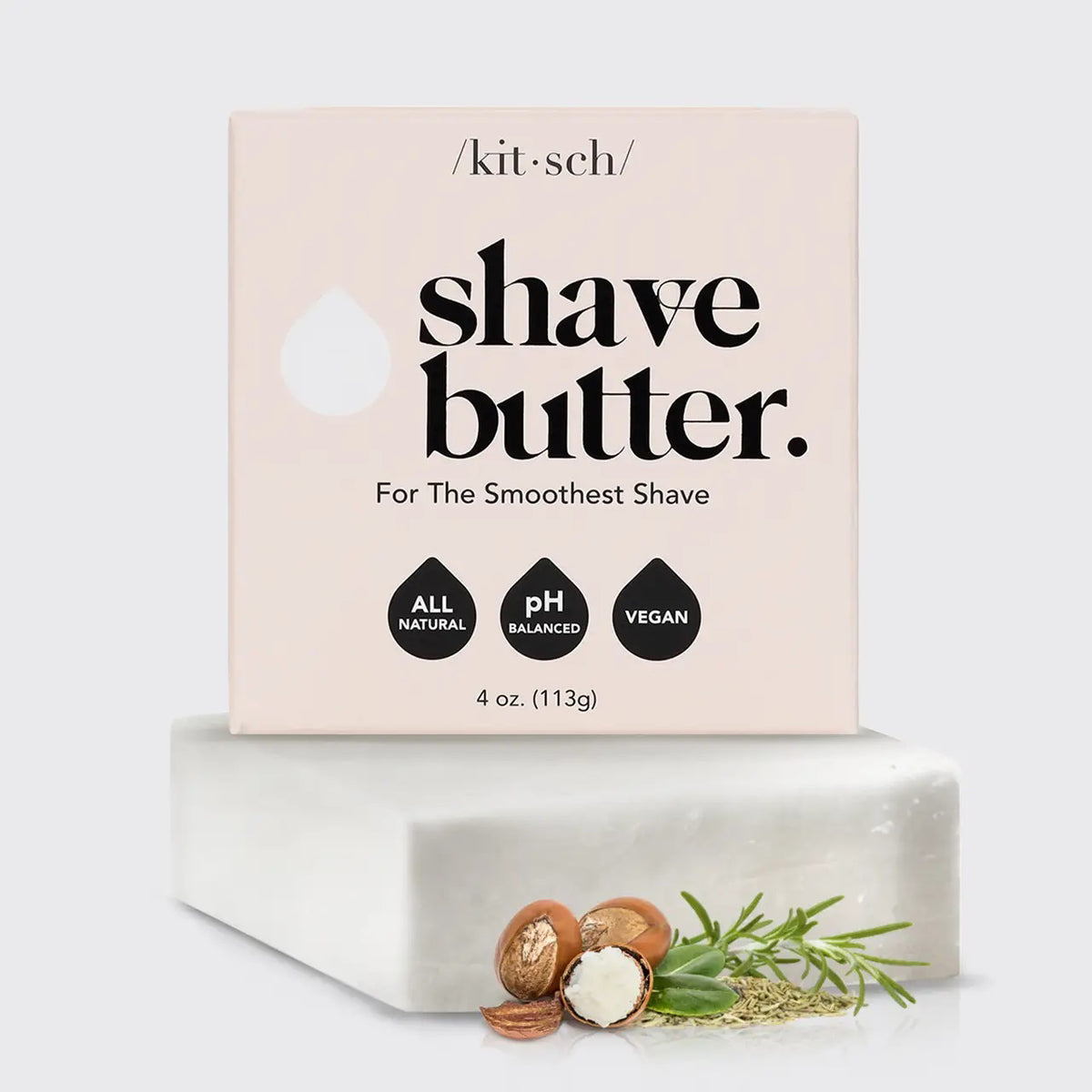A KITSCH - Shave Butter Bar rests on a marble block, promising the smoothest shave. The packaging emphasizes "All Natural," "pH Balanced," and "Vegan." Below are rosemary, argan nuts, and shea butter, highlighting its plastic-free shaving commitment.