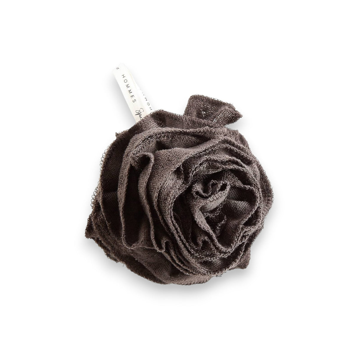 A black bamboo pouf, an eco-friendly bath accessory, nestled inside grey and gold packaging. The label reads &quot;EUROPEAN SOAPS, LLC&quot; with a sleek design that includes geometric patterns and the words &quot;Hommes&quot; and &quot;Spa Privé&quot;.