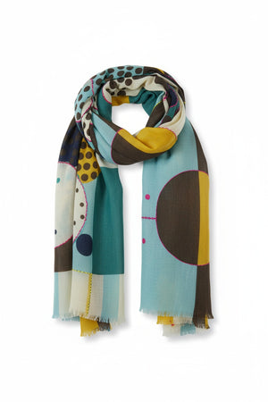 Introducing the STORIATIPIC - BAO Wool Scarf with Embroidery in Blue by STORIATIPIC: a generously sized (100 x 200 cm) wool scarf featuring a modern geometric pattern in teal, mustard yellow, brown, black, and white. Adorned with embroidered circles, dots, and rectangular motifs for a soft texture, this lightweight accessory is finished with frayed edges for added style.