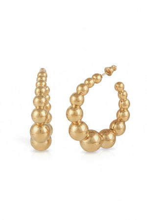 The GAS BIJOUX - ANDY CREOLE EARRING features gold plated hoops embellished with graduated spherical beads for a sophisticated, textured appearance. The hoops boast a shiny finish and are symmetrically arranged to elevate their chic design, all set against a plain white background.