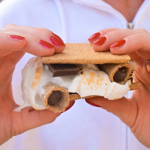 A bag of MUDDY BITES- MILK CHOCOLATE WAFFLE CONES against a brown background. The resealable packaging features the slogan "The Best Bit Over and Over Again" and boasts a 365+ day shelf life. This GMO-free product is also Kosher certified (D).